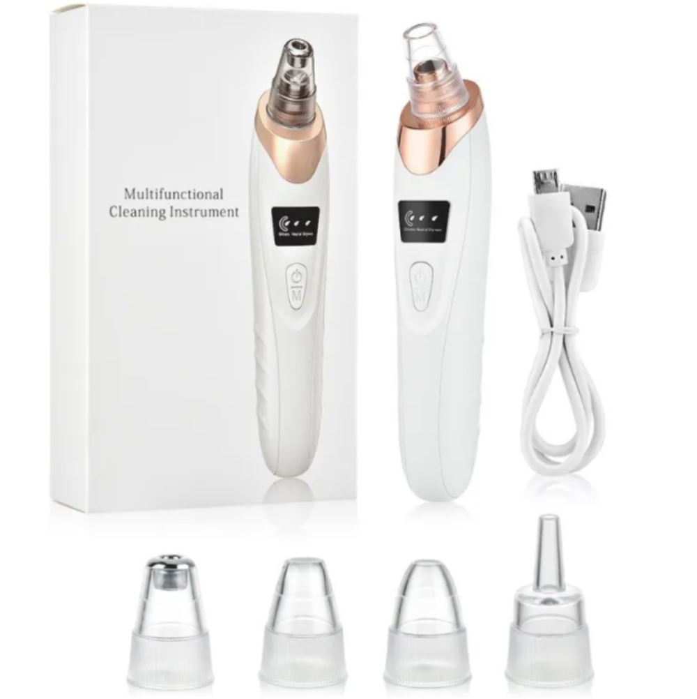 White and rose gold multifunctional facial cleansing and exfoliating device shown with its white retail box, white USB charging cable, and four clear silicone attachment heads on a white background.